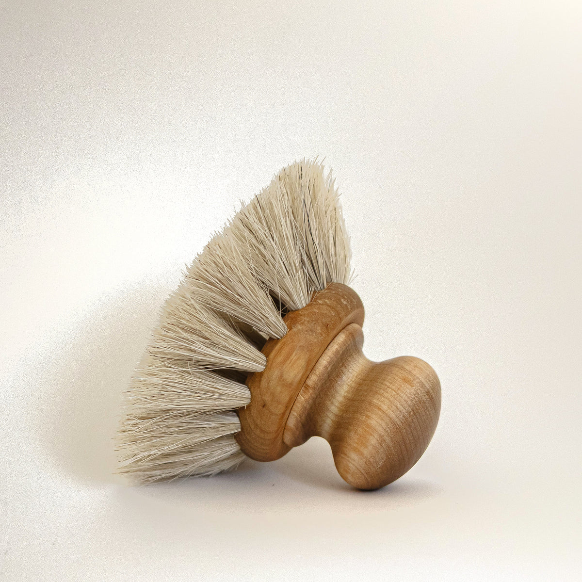 Round Everyday Dish Brush on its side showing the horsehair bristles